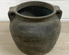 Unglazed grey decorative ceramic pot with a rustic look