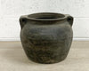 Unglazed grey decorative ceramic pot with a rustic look