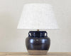 Table lamp made of antique black pot.
