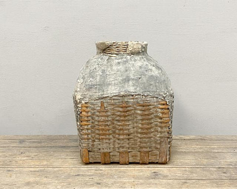 Large, weathered wicker oil basket