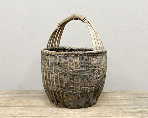 Old wicker basket with bamboo handle